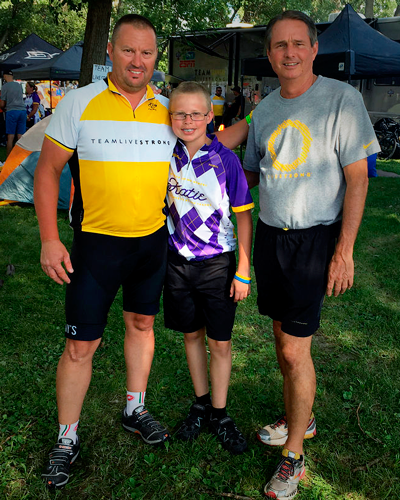 Deren Batterson (left) and his son Jake with Greg Lee, president of the Livestrong Foundation, during the 2016 RAGBRAI.