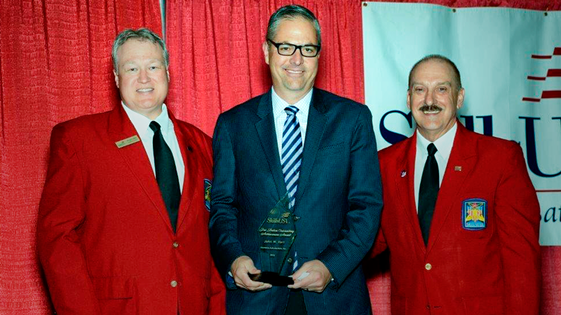 (L to R): Brent Kindred, president of the SkillsUSA Board of Directors; John W. Kett, president & CEO, Insurance Auto Auctions (IAA); Tim Lawrence, SkillsUSA Executive Director on the occasion of Kett being awarded the Pat Dalton Outstanding Achievement Award at the 52nd annual SkillsUSA National Leadership and Skills Conference held in Louisville, Ky., the week of June 21.