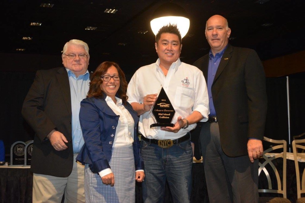 James Moy (second from right) receiving the 2015 National Auto Body Council Award of Distinction on behalf of Mid Island Collision, an award that honors acts of bravery, philanthropy or selflessness that helps improve the image of the auto body industry.